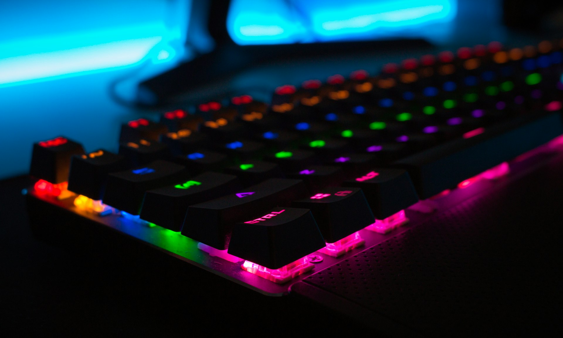 Prompt: A high-end mechanical gaming keyboard with vibrant RGB lighting in a dark cyberpunk environment, sharp focus, cinematic lighting, no characters